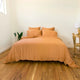 Bộ chăn ga gối | Jacquard Tencel | Trơn 60s | | 5 món | 160x200cm, 180x200cm, 200x220cm | Cam Đất mix Ivory | Mềm mại, Kháng khuẩn, Thấm hút | OCTOBER BEDDING